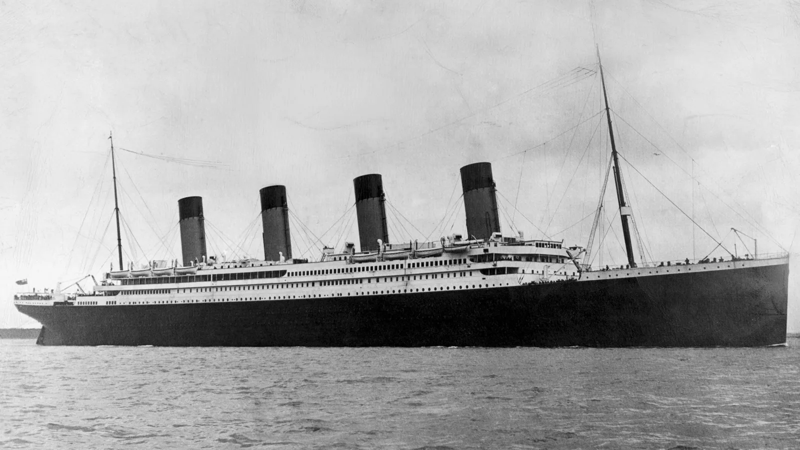 black and white photo of the Titanic sailing on open waters